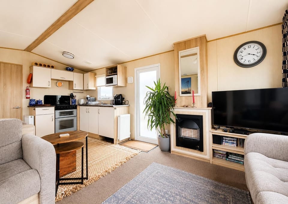 Enjoy waking up to partial sea views from your living room in this modern caravan in Suffolk.