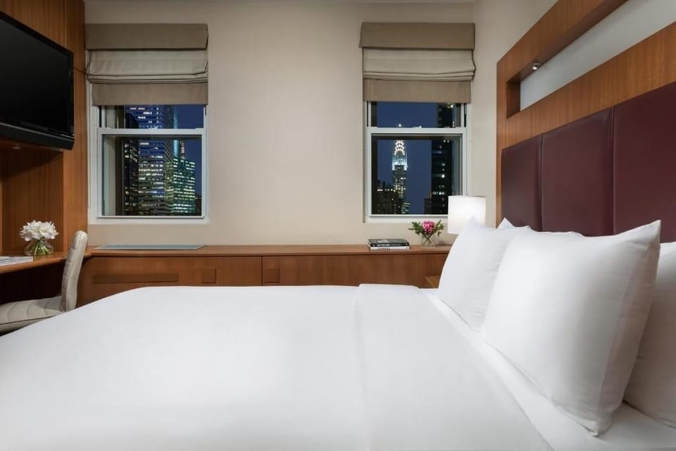 Unwind with sparkling skyline views as the city lights glow.