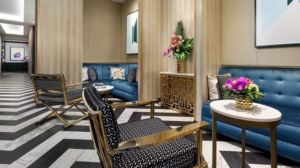 Arrive in style beneath artful lighting and polished marble floors.