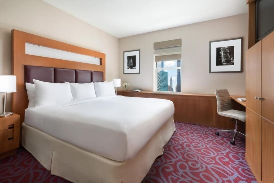 Stretch out in a serene room with bright city views.