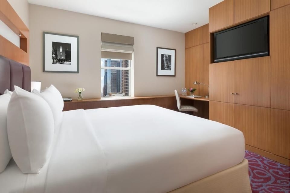 Settle in with a roomy layout, TV, and work nook.