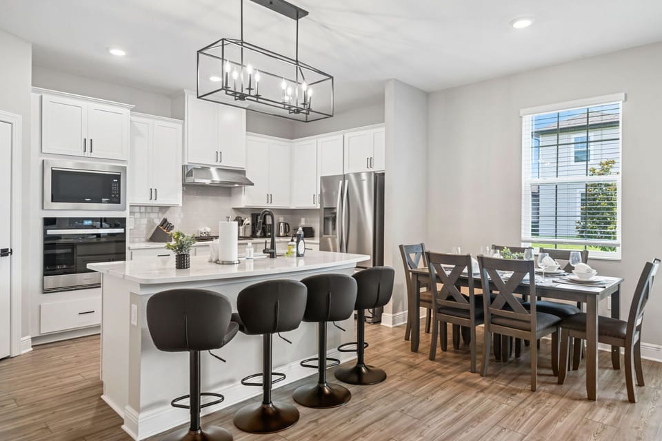 This stunning living space boasts plenty of seating and natural light. 