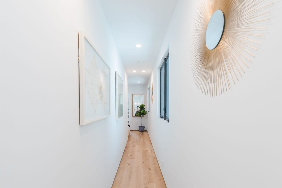 Second level hallway connects the main stairway to two bedrooms and one bath.
                
