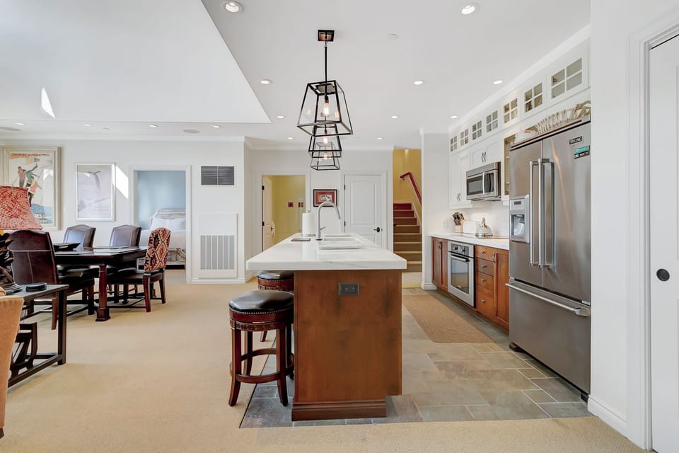 - Modern kitchen with stainless steel appliances   - Large island with bar seating for casual dining   - Perfect for cooking after a day on the slopes