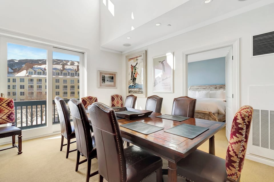 - Scenic dining area with mountain and resort backdrop   - Spacious table for family dinners or morning brunch   - Ski-themed artwork adds charm to your alpine stay