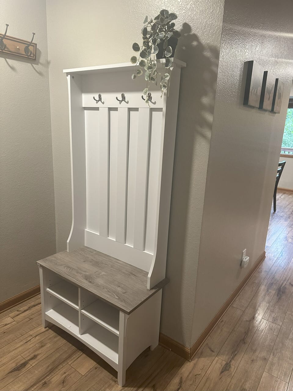 Mud room with plenty of hooks for coats, bags and storage for shoes.