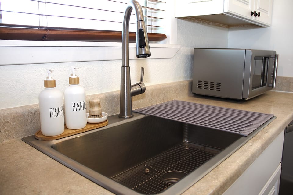 Bottled water unnecessary, the tap water is great here!  Fridge has ice maker.