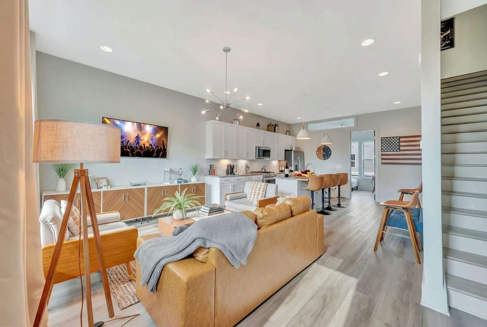 The kitchen island with bar stools opens directly into the living room, so the cook never misses a beat of what's happening with the group