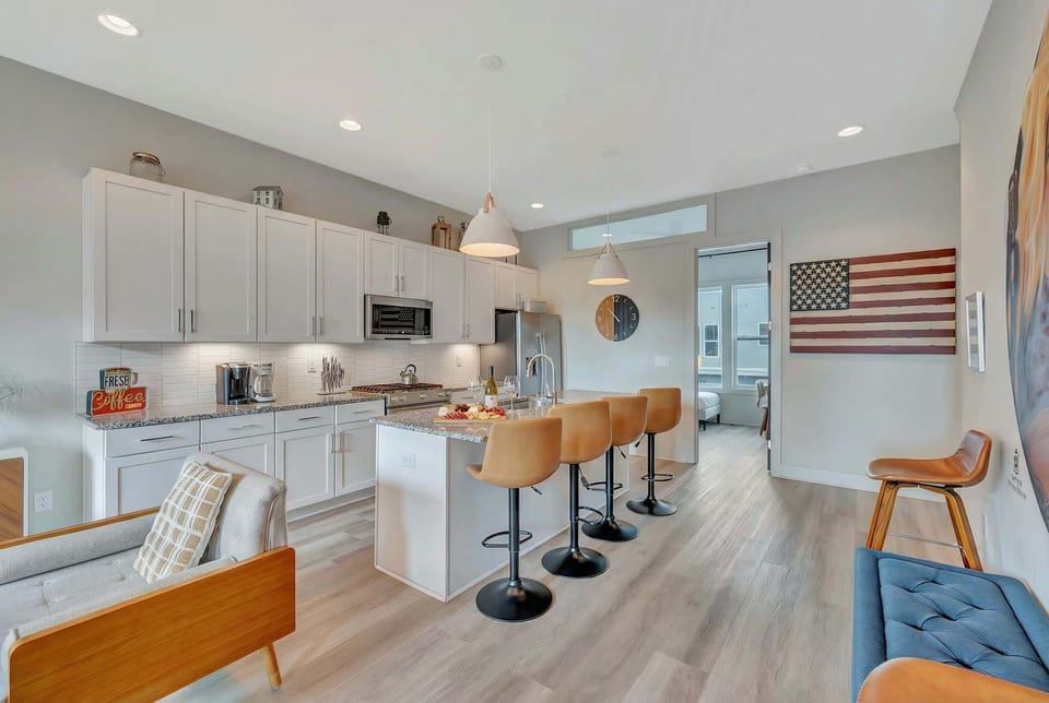 Kitchen island with bar seating keeps the cook in the conversation while everyone grabs a coffee or rounds on stools