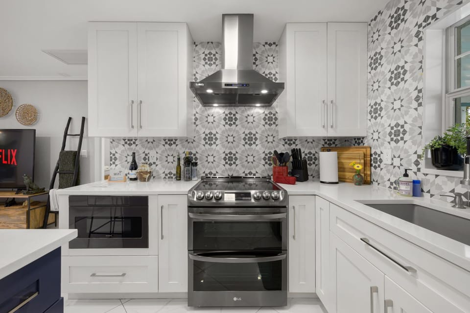 Enjoy cooking and gathering around the large island, featuring high-end appliances that make meal prep a breeze.

