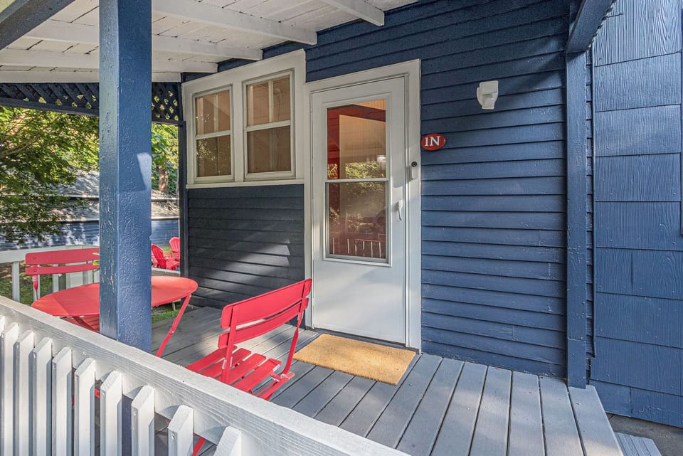 Front porch with a screen door and sensor light.