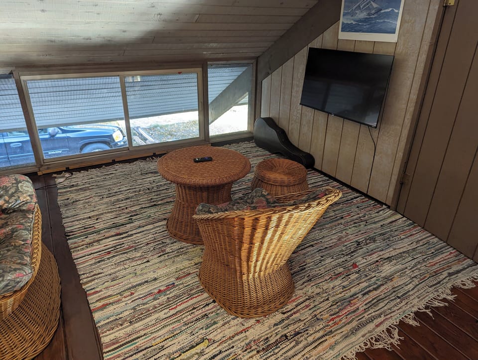 LIVING ROOM #2:  The cute upstairs living room with a couch and seat for sitting down and watching TV