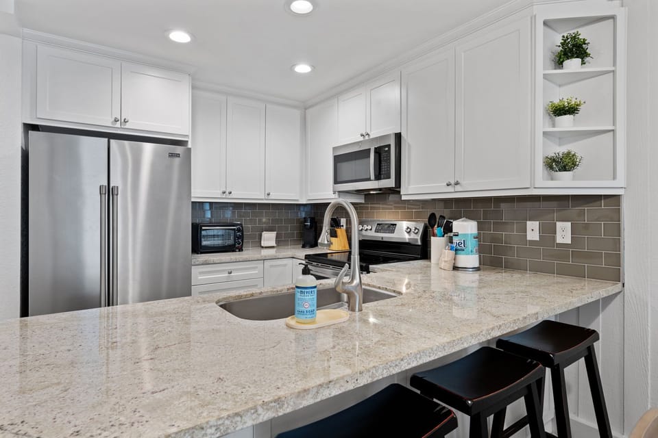 The kitchen bar offers seating for four, great for kids or casual dining on the go.