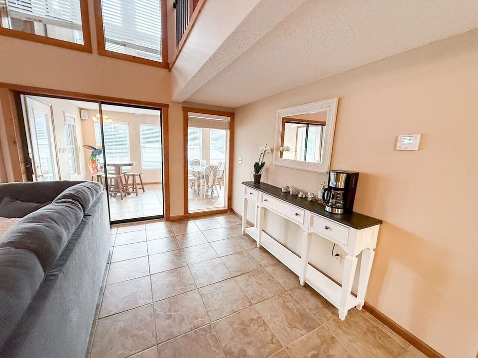 A living room that brings the outside in—bright, breezy, and ready for your crew.