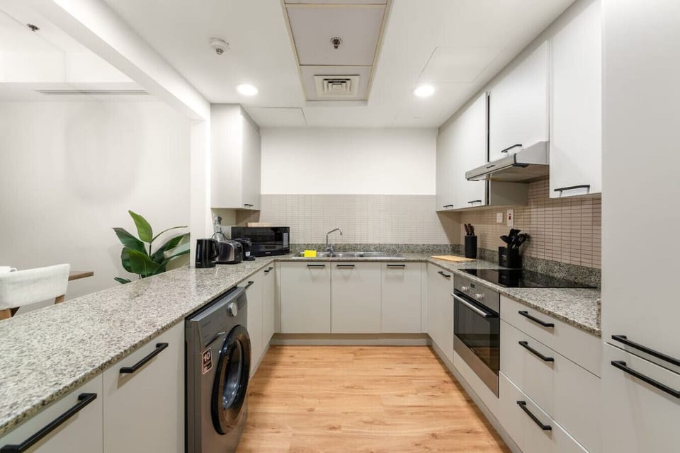Modern Kitchen: Whip up culinary delights in this stylish, fully-equipped space!