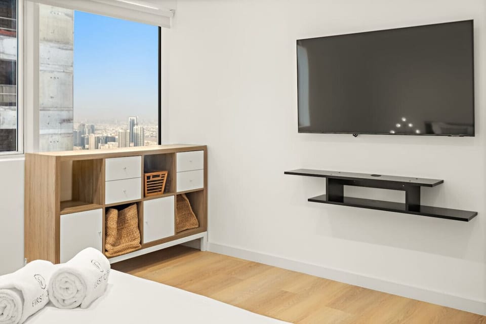 Modern Retreat: Enjoy stunning skyline views and sleek furnishings in this stylish oasis!