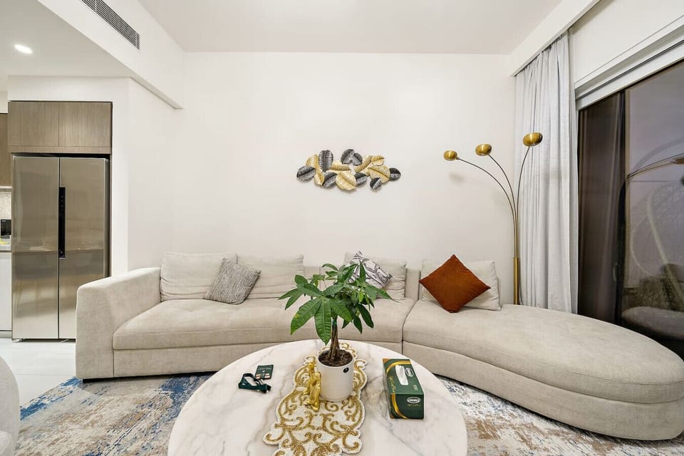 Living Room: Relax in style with chic decor, plush seating, and a touch of greenery.
