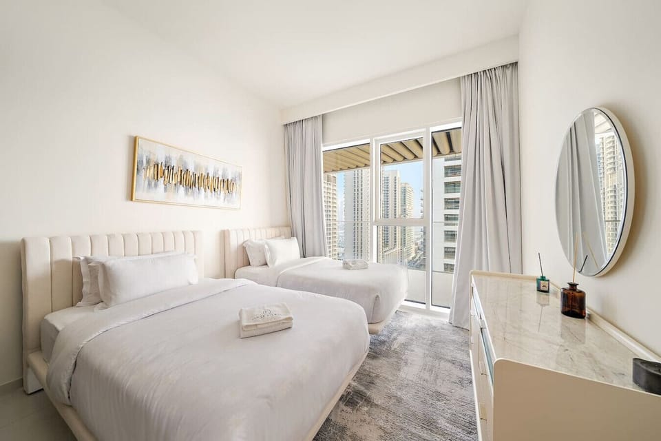 Twin Room: Bright and airy retreat with skyline views and modern decor! Perfect for friends or family!