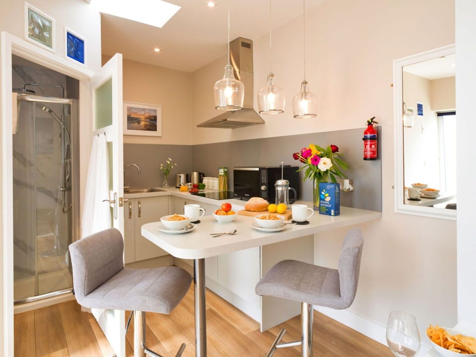 Furniture, Interior Design, Kitchen Appliance, Kitchen, Countertop, Flooring, Major Appliance, Wood, Cabinetry, Floor