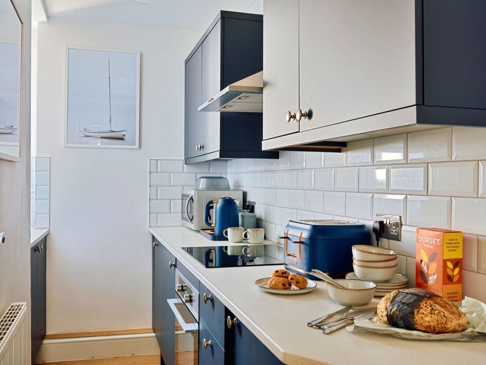 Kitchen, Interior Design, Kitchen Appliance, Countertop, Cabinetry, Major Appliance, Flooring, Home Appliance, Furniture, Floor