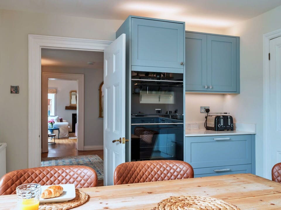 Furniture, Countertop, Interior Design, Cabinetry, Kitchen, Kitchen Appliance, Flooring, Wood, Major Appliance, Ceiling