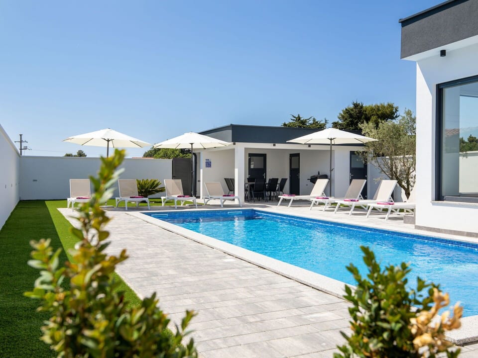 Swimming Pool, Resort, Outdoor Furniture, Patio, Design, Chair, Villa, Sunlounger, Hotel, Courtyard