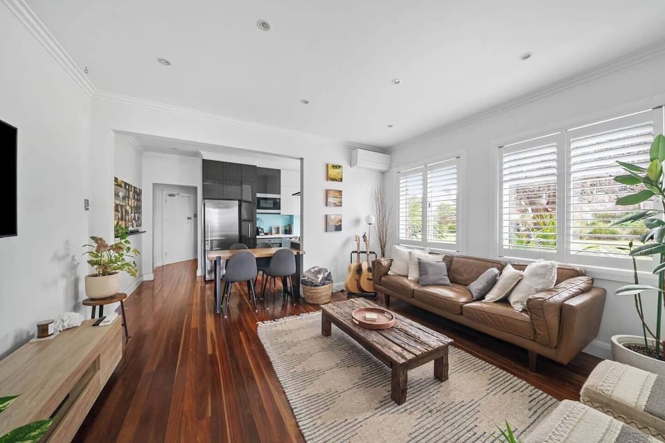 Start your day in the open-plan area where natural light, timber floors and layered textures create a welcoming spot to relax, dine or plan your coastal adventures.