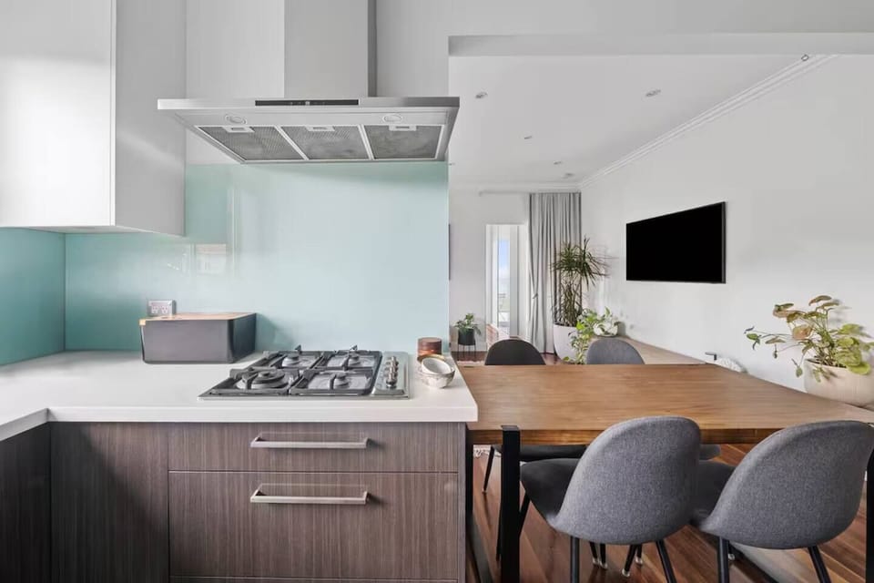 Enjoy conversation and connection as the kitchen opens seamlessly to the dining and living area, creating a social hub perfect for shared meals or quiet mornings.