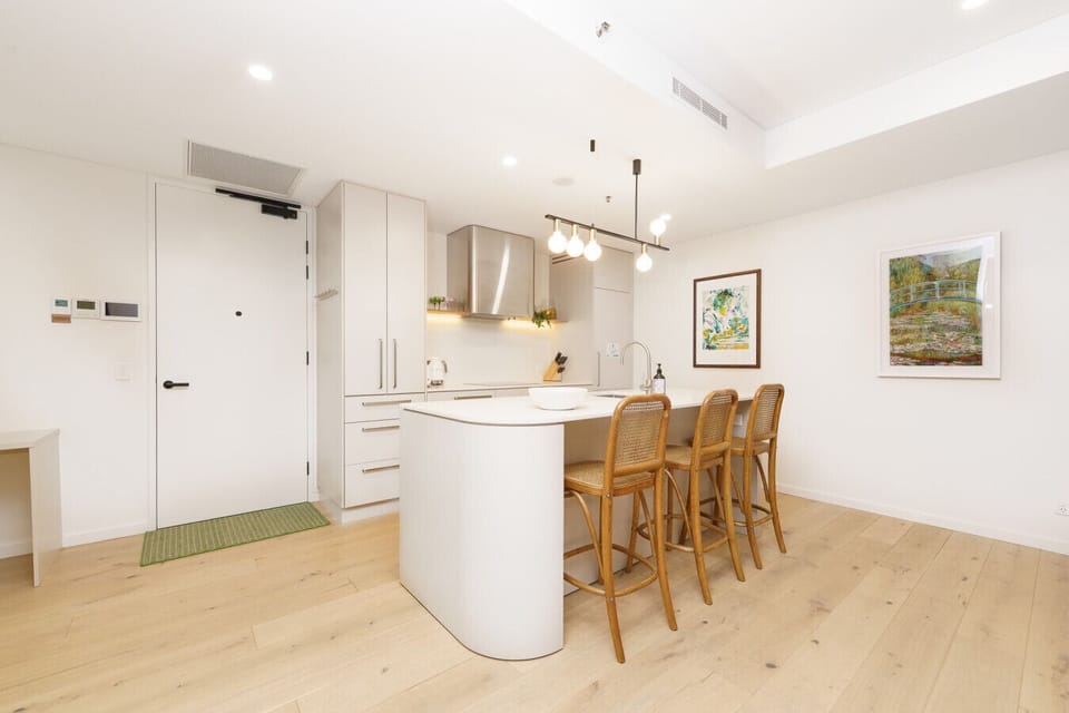 Cook, gather, and graze in a bright, functional kitchen with modern appliances and inviting dining space.