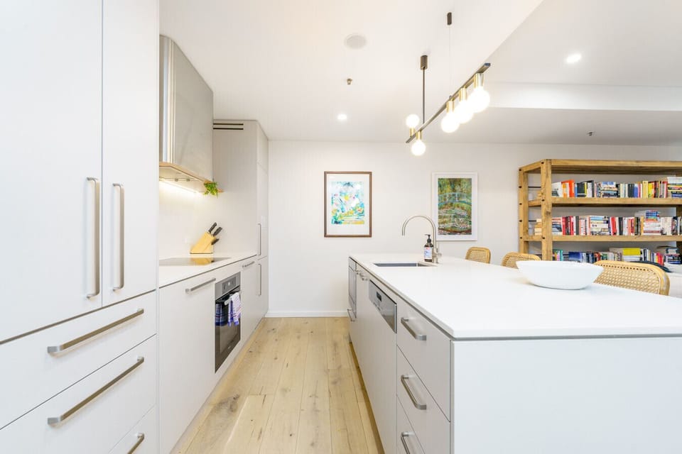 Whip up flavors in a bright, functional space with clean cabinetry