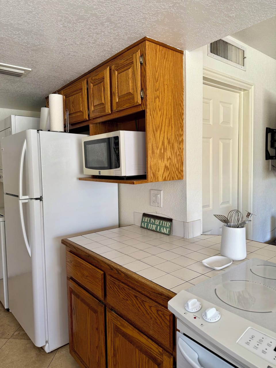Microwave, fridge and stacked washer /dryer