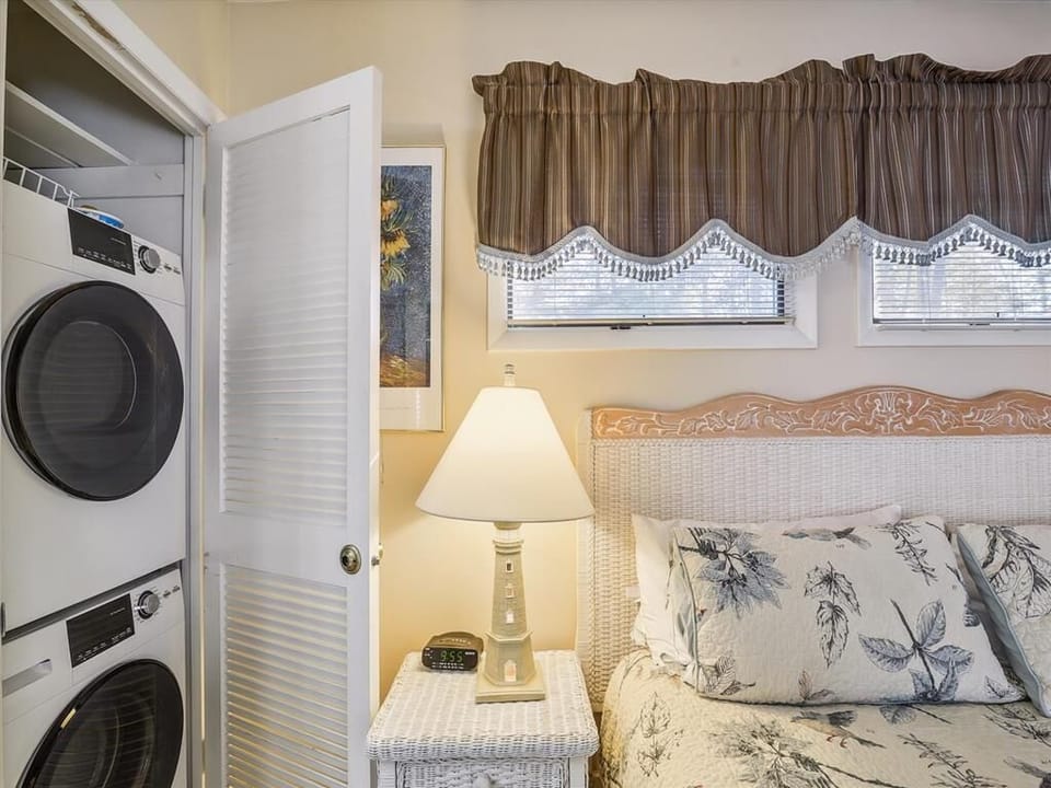 In-suite laundry conveniently located beside the cozy bedroom with king bed.