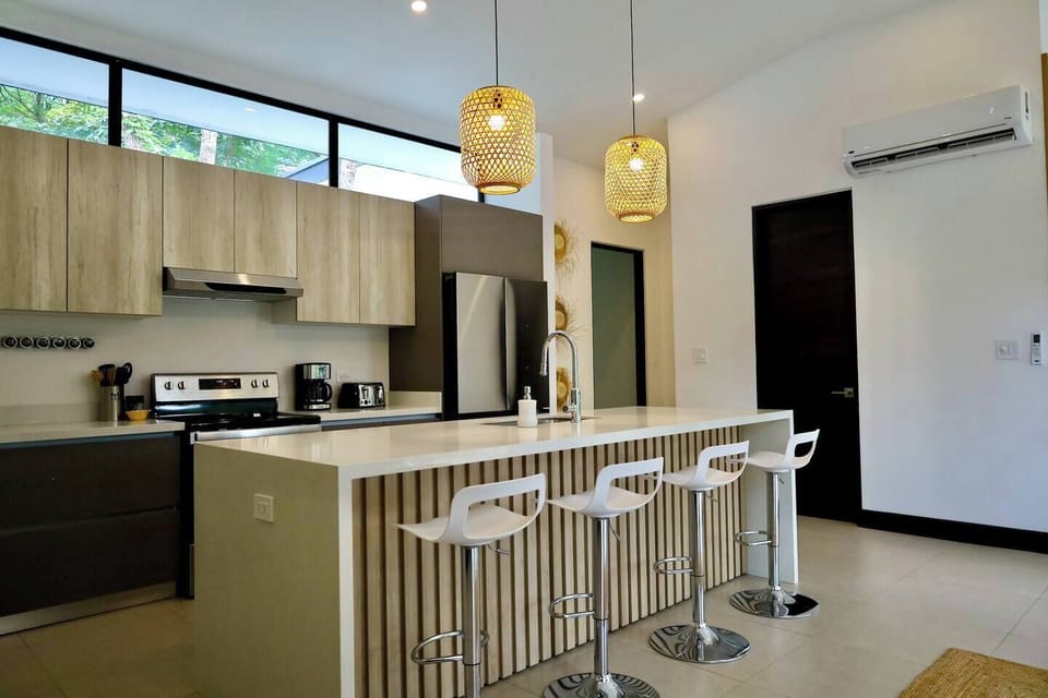 A fully stocked kitchen complete with plates, glassware, cutlery, & cookware will make meal prepping a breeze all while taking in the views.