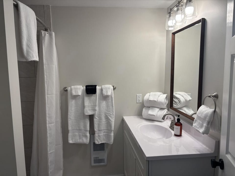 Clean and functional private bathroom just off the main room.