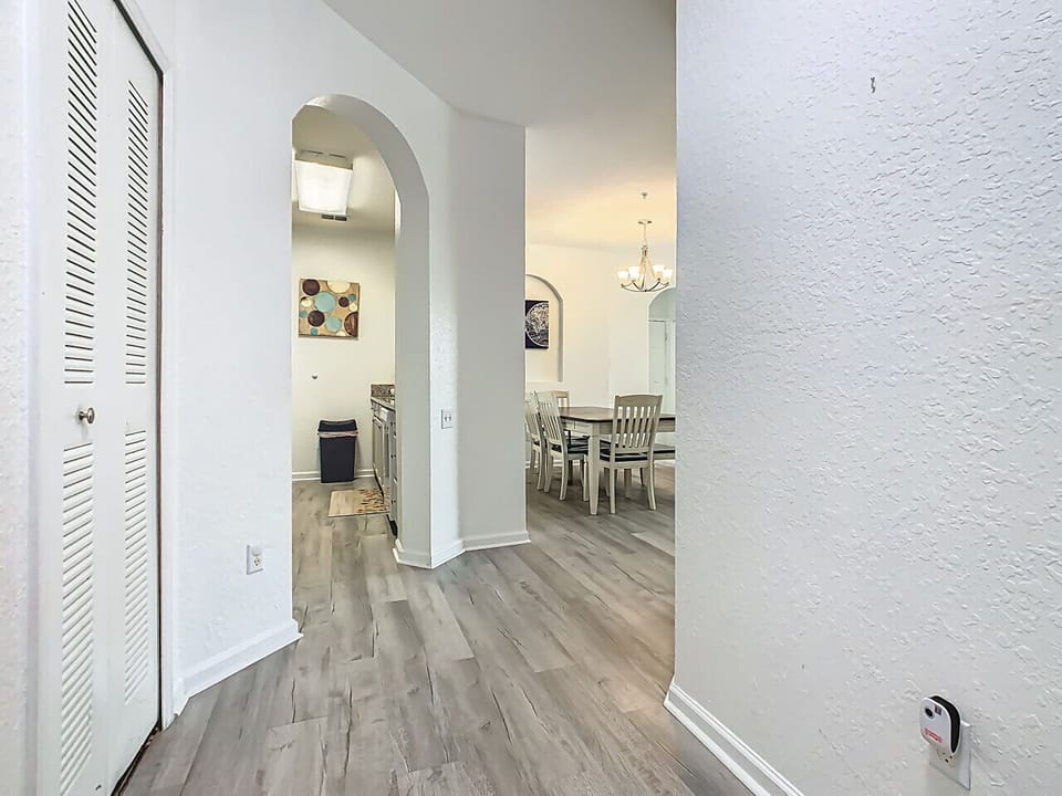 Bright hallway leading into the dining area and kitchen.