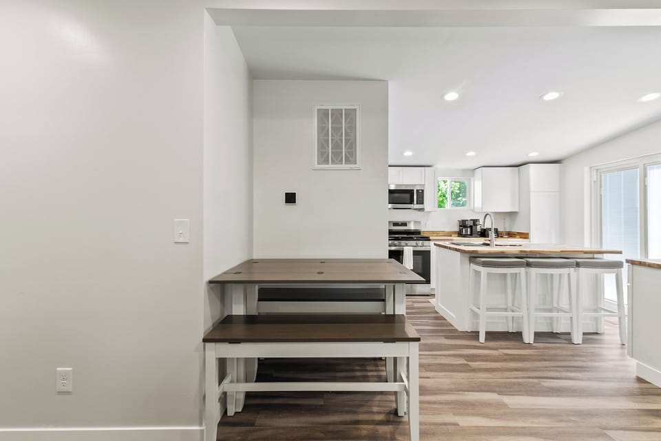 The Waterbury Way - Kitchen Table that seats 6. Seats open up for storage.