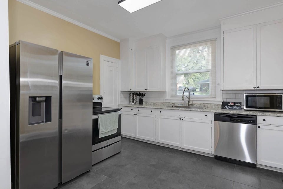Kitchen has a stove, dishwasher, microwave, refrigerator/freezer with water dispenser