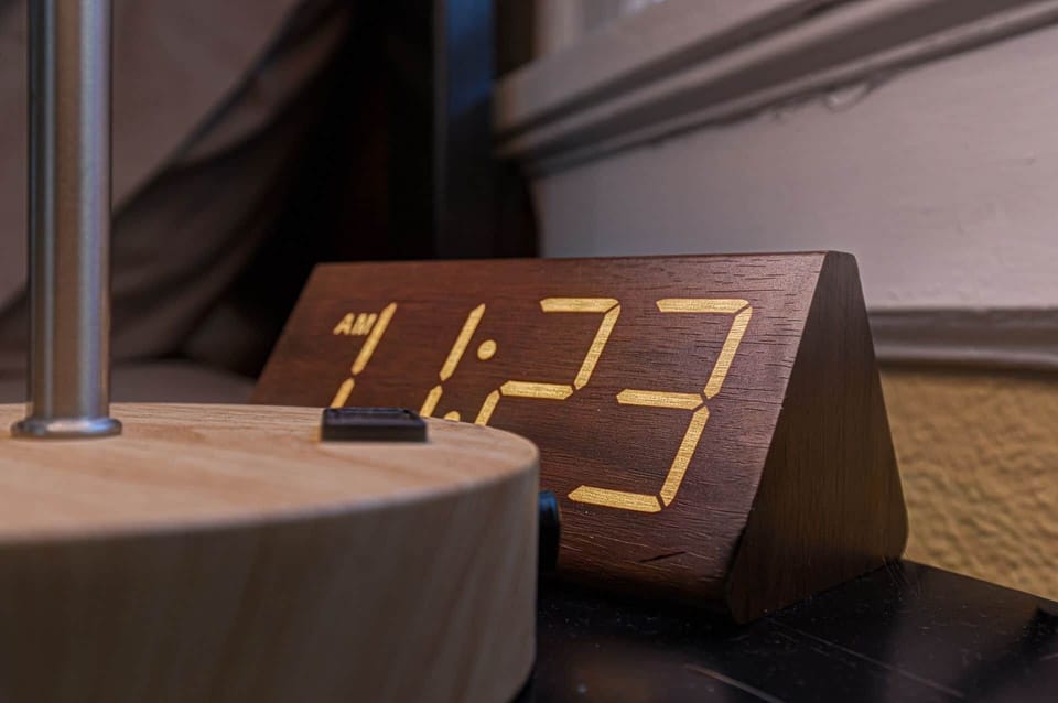 Nightstand with alarm clock and lamp