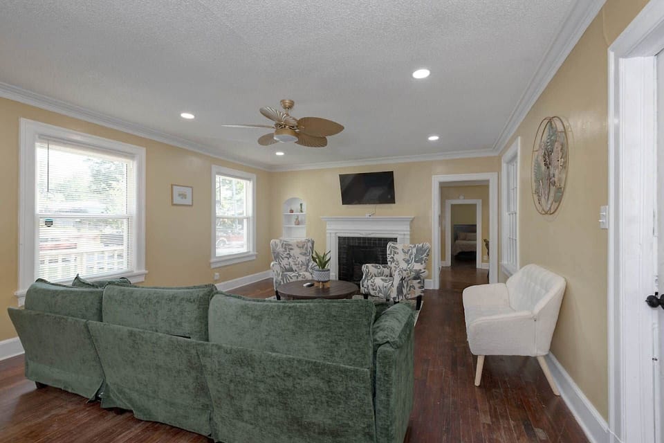 Living room has one sofa, a love seat, and two chairs