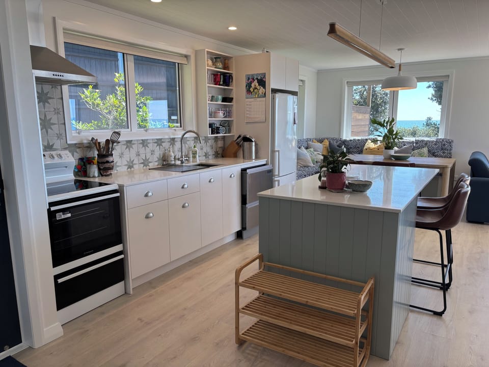 Brand new kitchen with double drawer dishwasher and ceramic topped stove. 