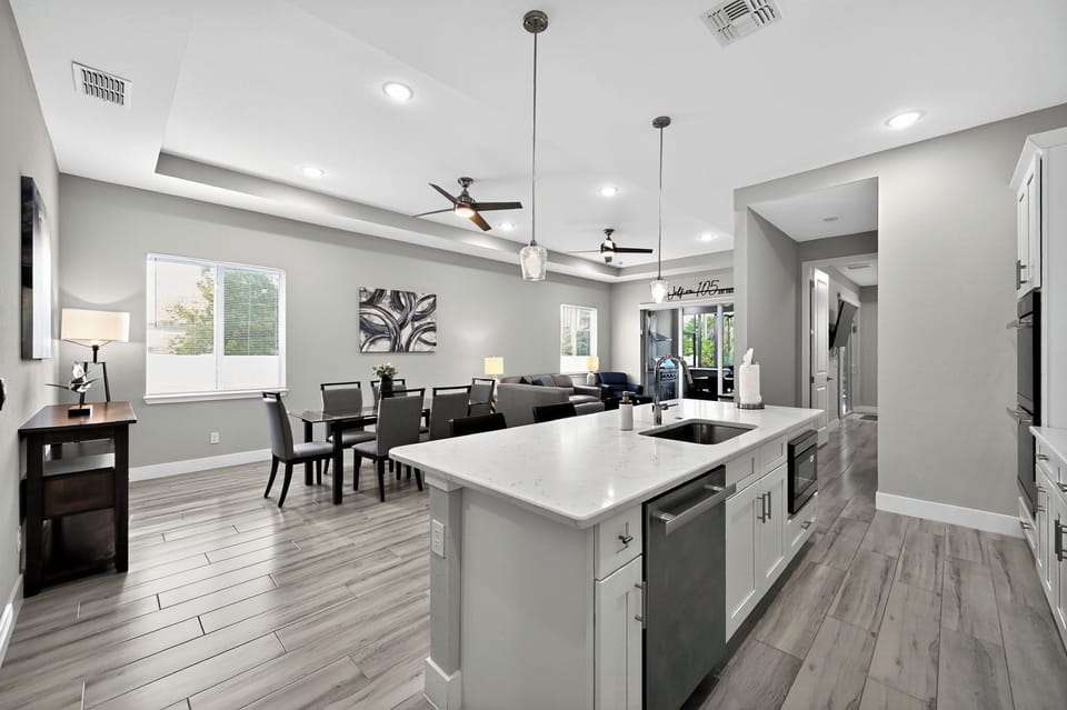 Open Concept Living Room: Enjoy spacious living with modern decor and natural light throughout!