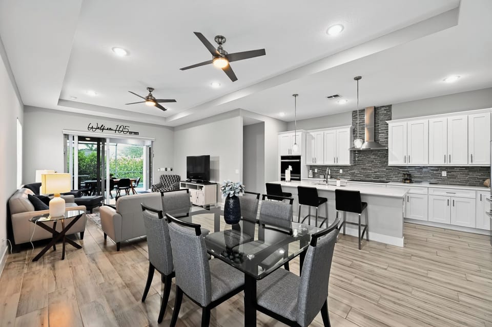 Dining Area: Enjoy meals under bright lighting with views of the lush backyard—dine in style!