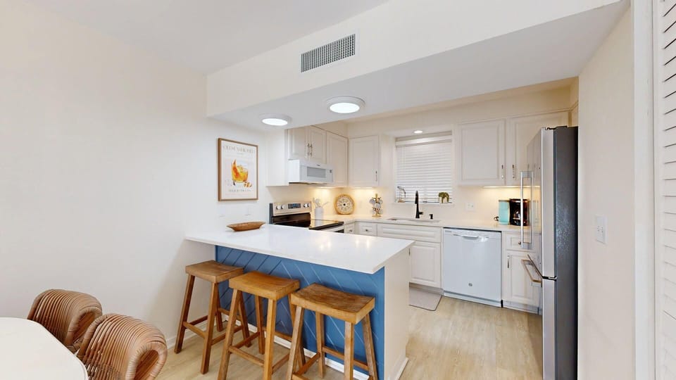 Fully Stocked Kitchen with Bar Seating