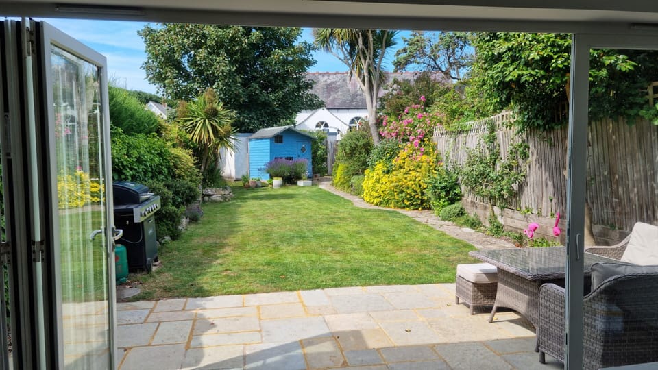 Folding sliding doors from dining area and kitchen to garden