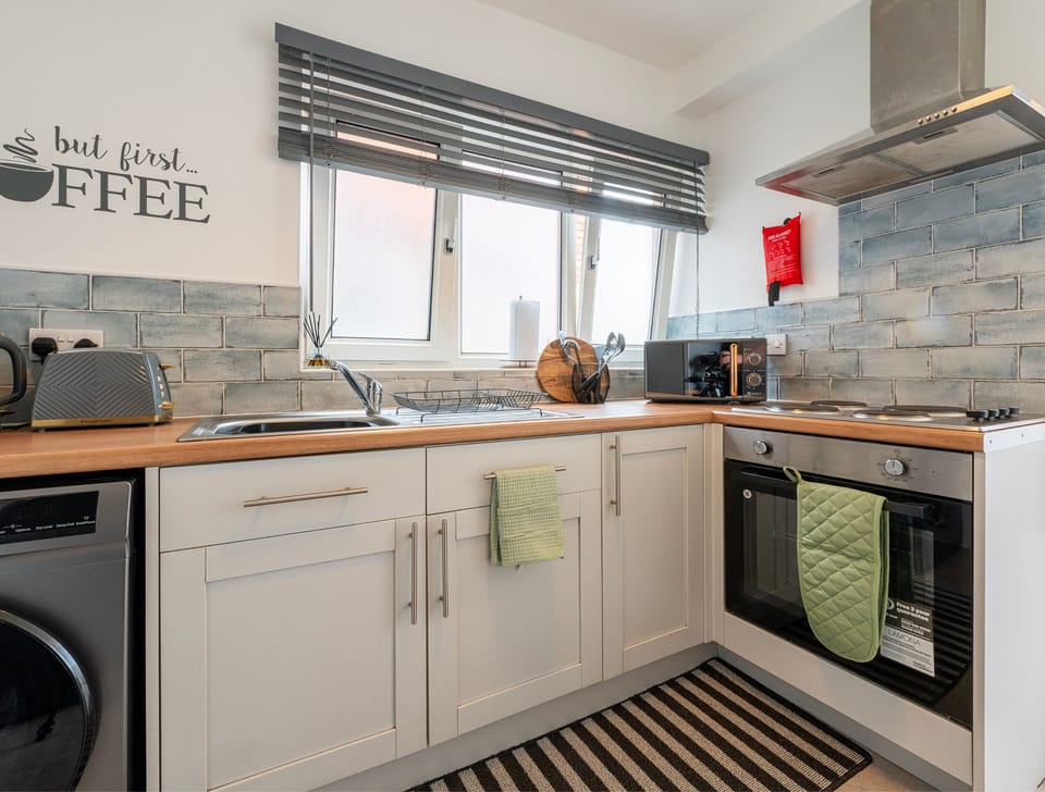 Microwave, oven & cooking utensils provided at property.