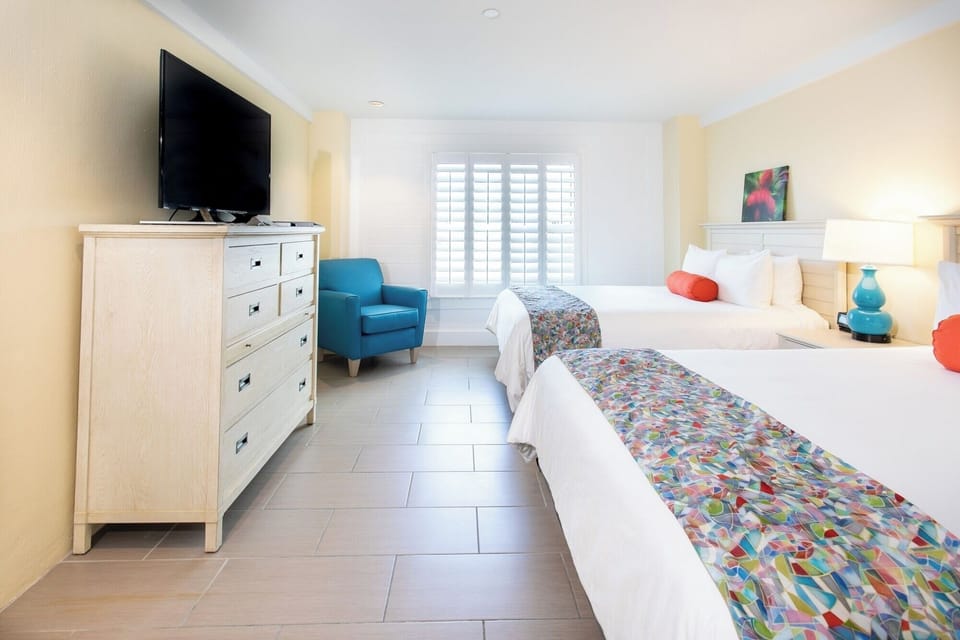 Stretch out with roomy layout, TV time, and cozy chair.