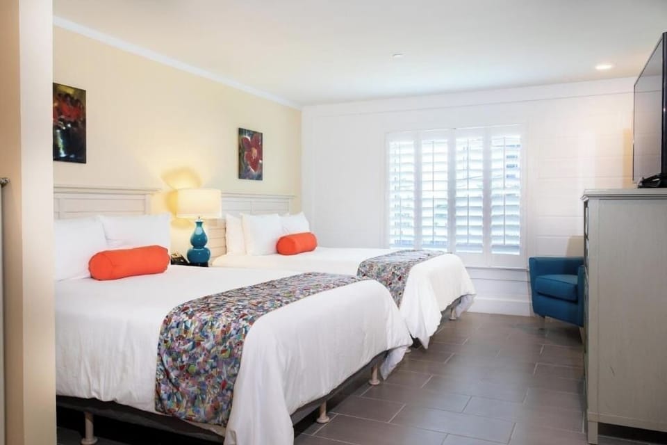 Unwind in bright, airy beds with crisp linens.