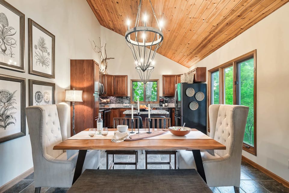 Functional kitchen and dining area with table seating and bar counter.