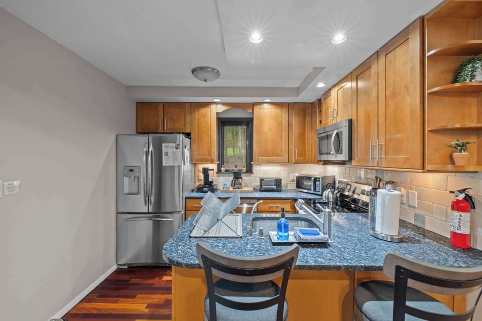 Whip up culinary delights in this modern, stylish kitchen with natural views!