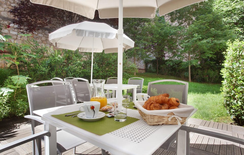 Enjoy an al fresco breakfast or snack on the garden terrace — buffet breakfast is available for an additional fee.